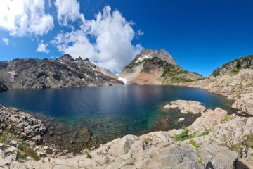 a panoramic view of Foggy lake just outside Gothic Basin