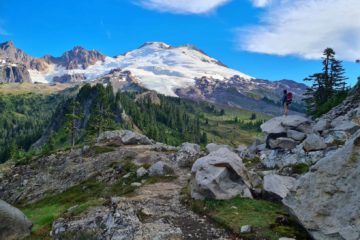 me with my backpacking gear standing on a rock starting at Mt. Baker Washington