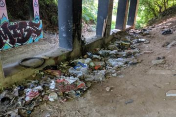 trash along the atlanta beltine before an REI clean up